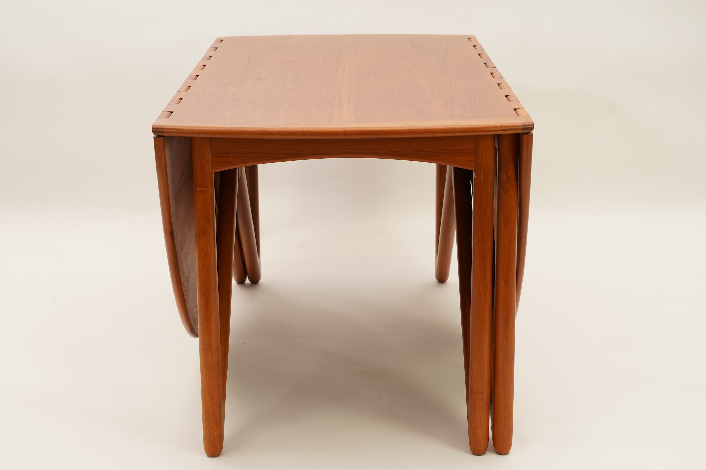 Niels Koefoed (Danish, b. 1929) for Koefoeds Møbelfabrik: A teak 'Oval Klap' dining table